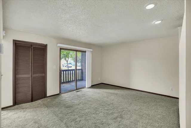 an empty room with a empty space and windows