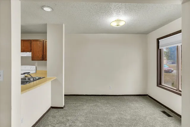 a utility room with cabinets washer and dryer