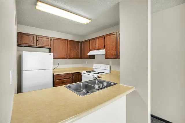 a view of an empty room with windows