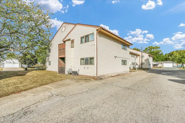 a view of a house with a street