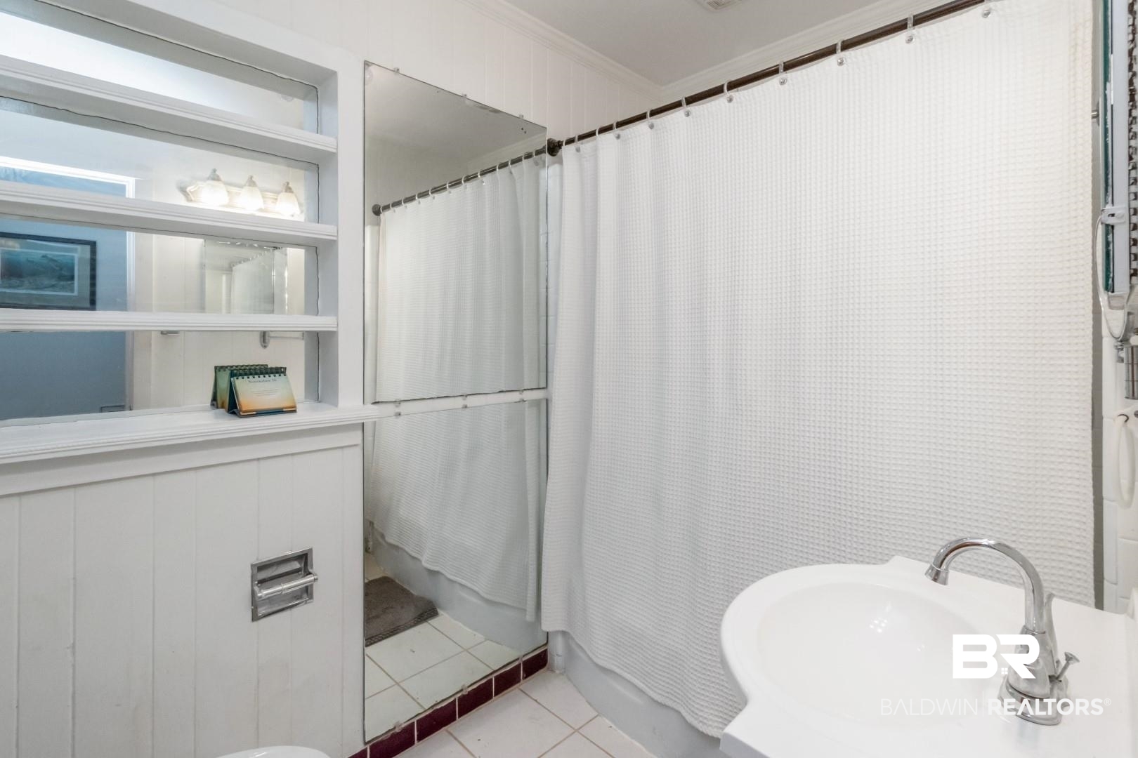 20 Kirby Street Mobile, AL 36607 - Photo 16 of 35 Bathroom featuring tile patterned flooring, crown molding, and sink
