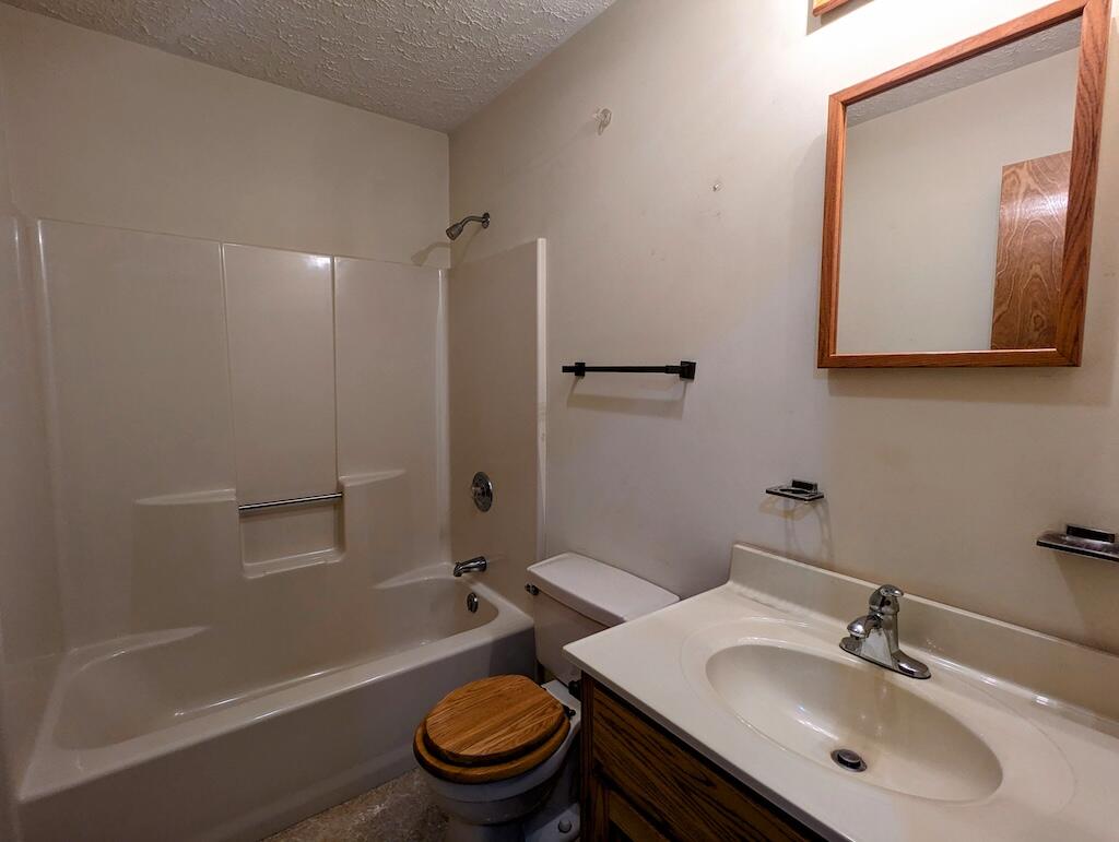 1518 Penn Road Northwest Floyd, VA 24091 - Photo 16 of 27 a bathroom with a sink toilet and shower
