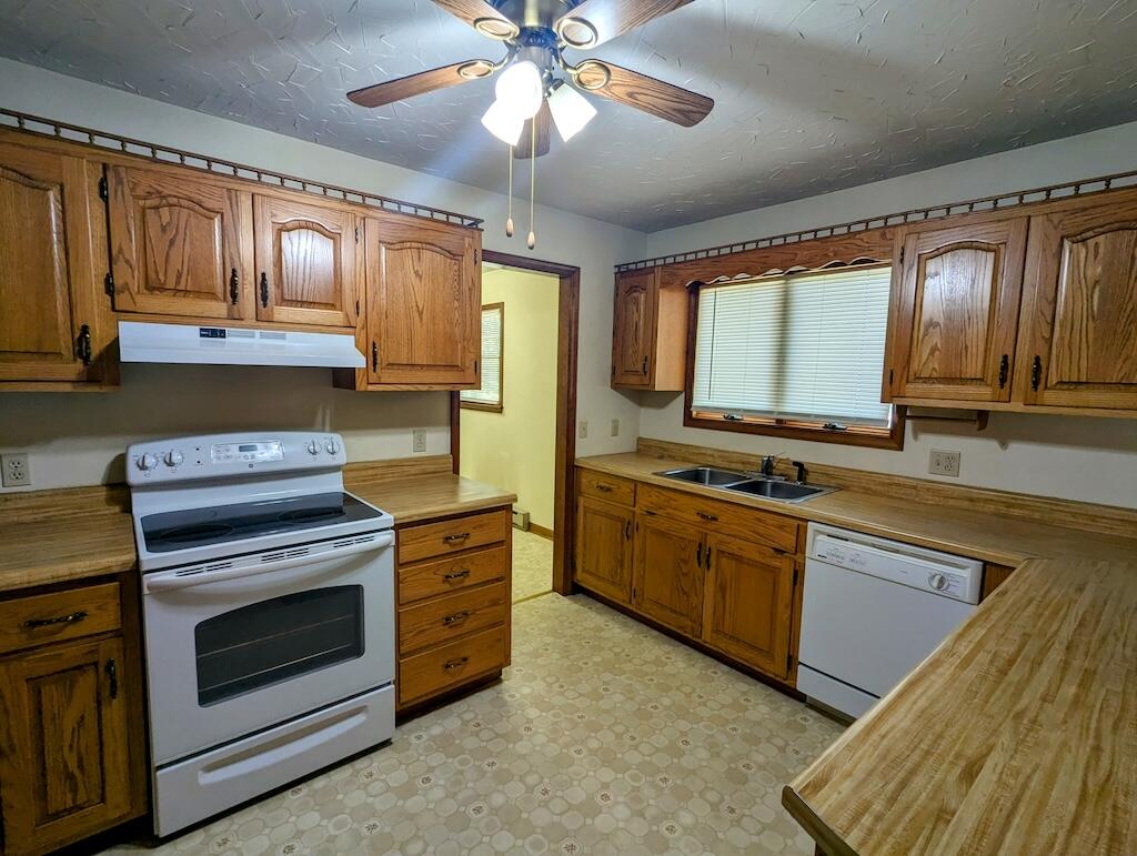 1518 Penn Road Northwest Floyd, VA 24091 - Photo 7 of 27 a kitchen with stainless steel appliances granite countertop a stove sink and cabinets