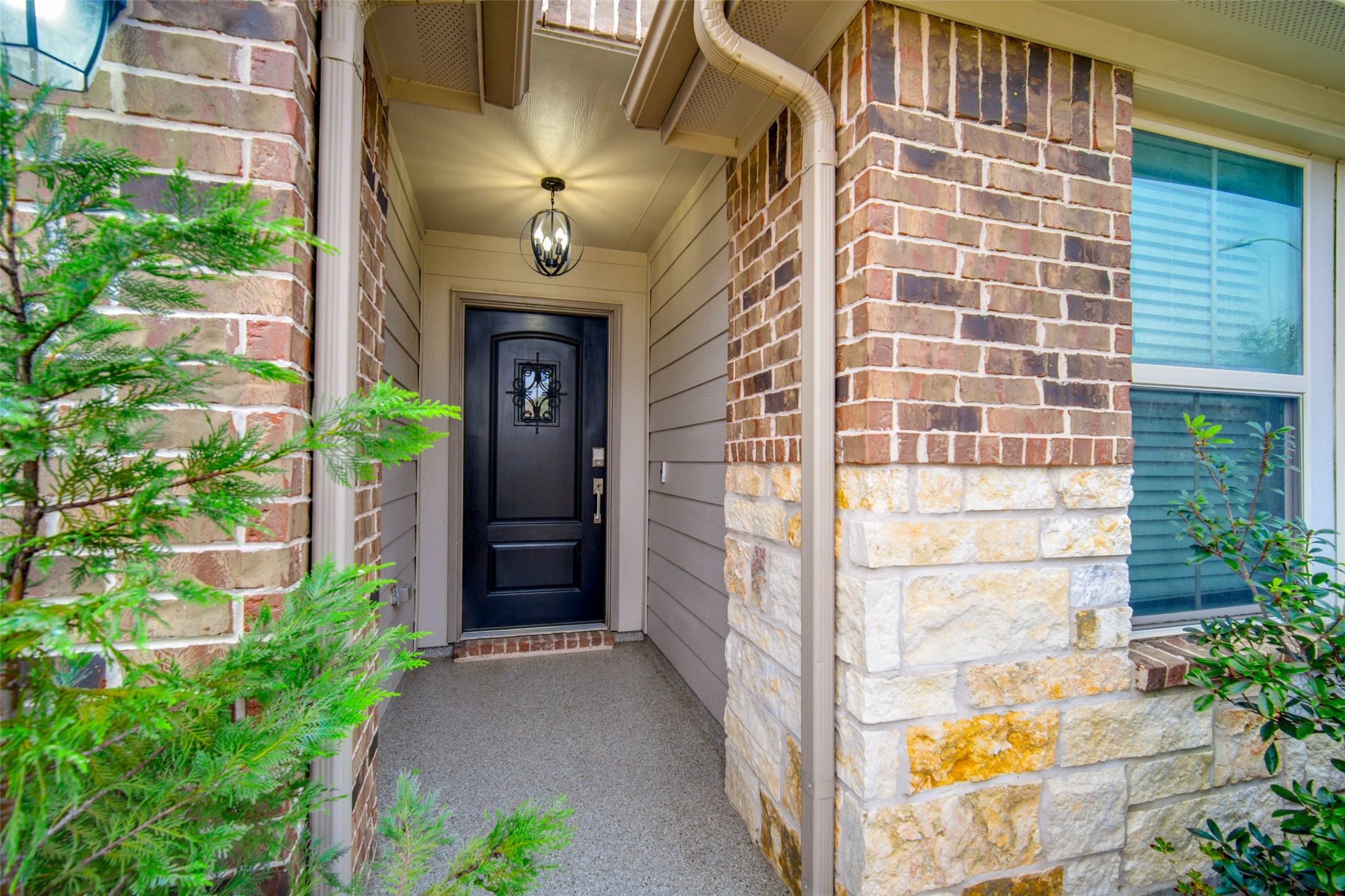 24239 Gold Cheyenne Way Katy, TX 77493 - Photo 5 of 38 a view of a brick house with windows