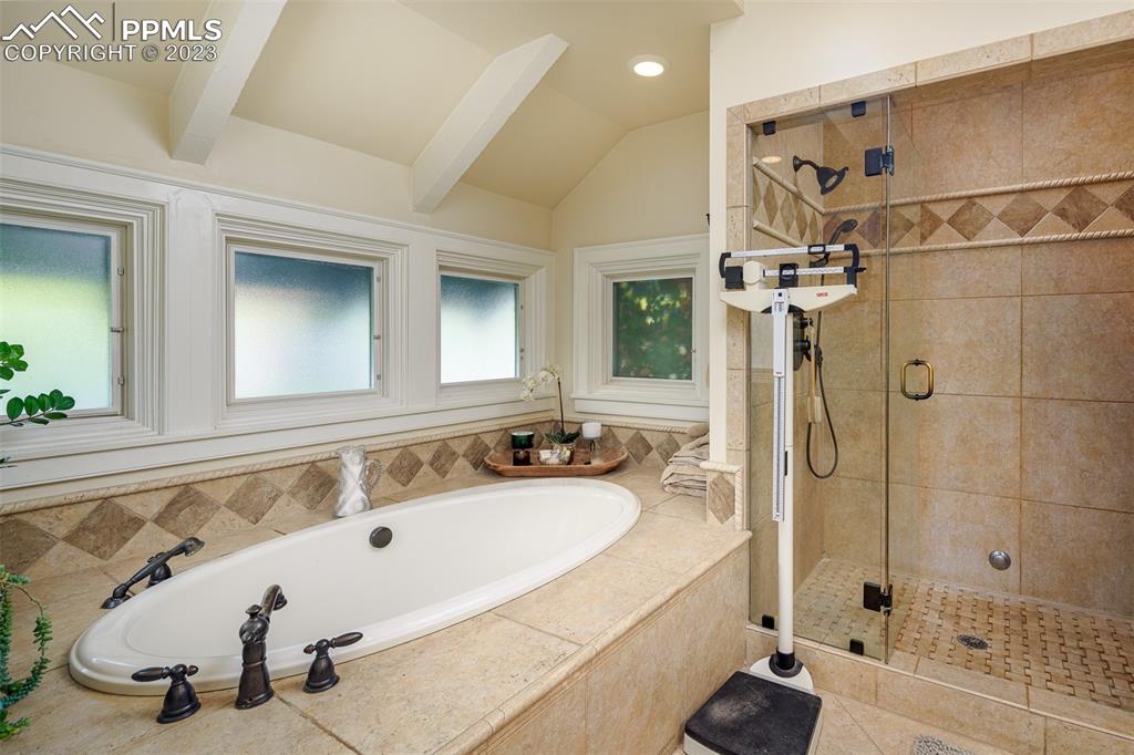 7 5th Street Colorado Springs, CO 80906 - Photo 11 of 46 a bathroom with a tub sink and mirror