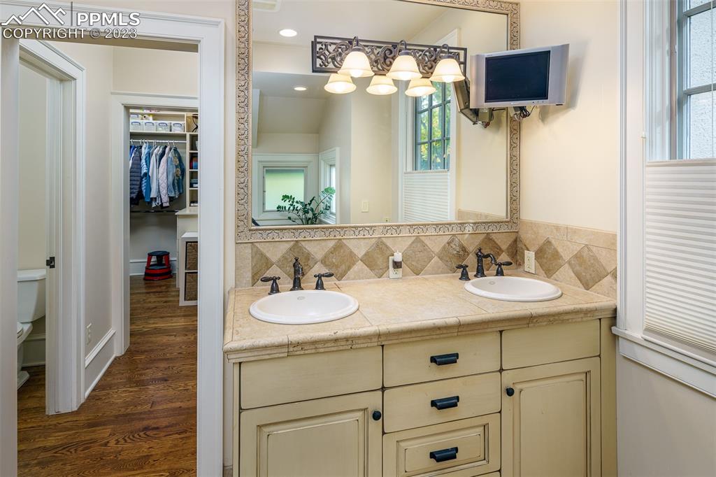 7 5th Street Colorado Springs, CO 80906 - Photo 12 of 46 a bathroom with a sink and a mirror