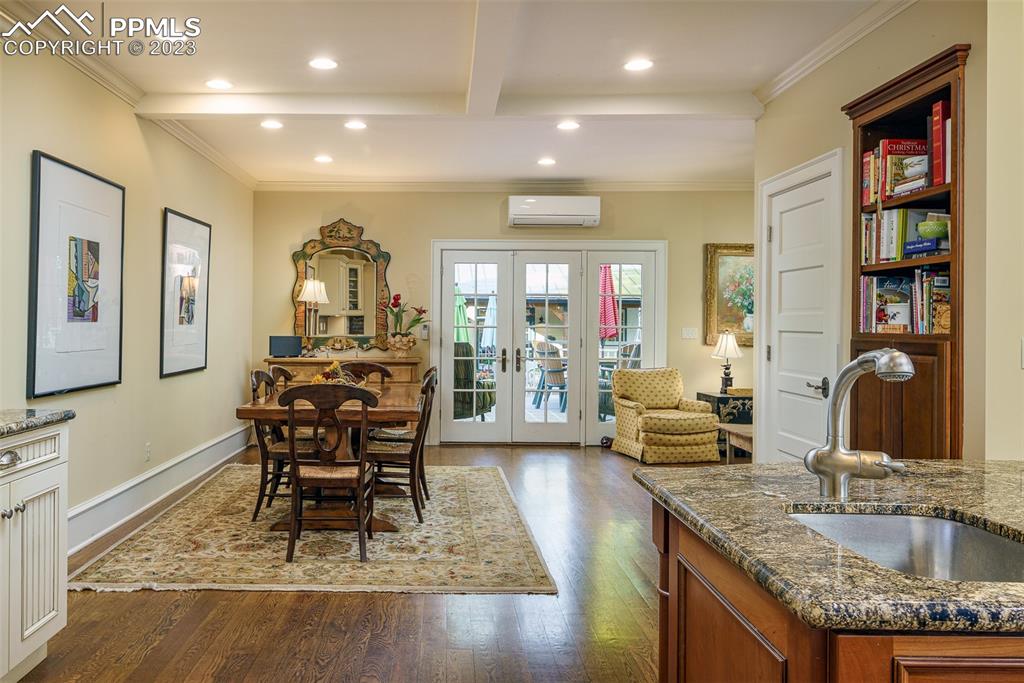 7 5th Street Colorado Springs, CO 80906 - Photo 15 of 46 a dining room with granite countertop furniture a rug and a chandelier