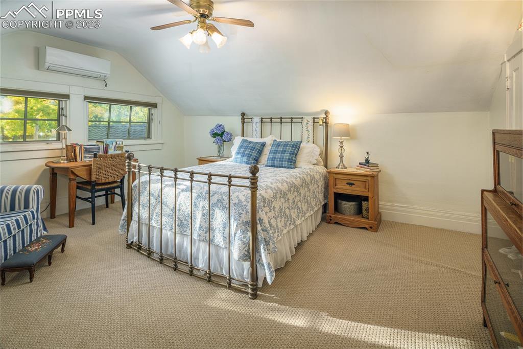7 5th Street Colorado Springs, CO 80906 - Photo 22 of 46 a bed room with a bed and a chair