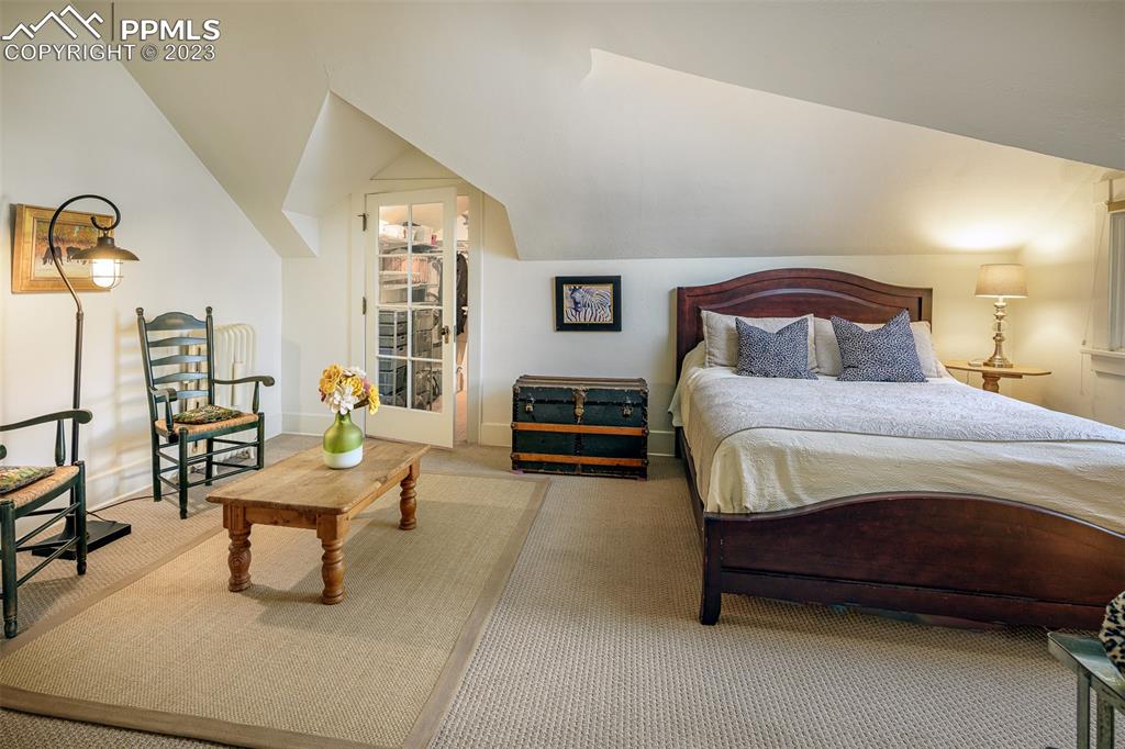 7 5th Street Colorado Springs, CO 80906 - Photo 23 of 46 a bedroom with a bed and a couch