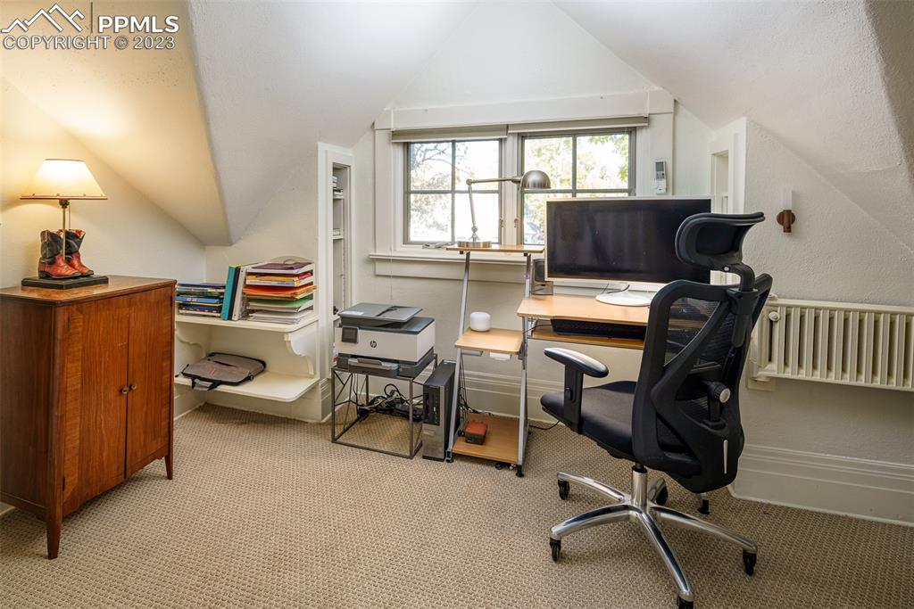 7 5th Street Colorado Springs, CO 80906 - Photo 24 of 46 a view of a livingroom with workspace and a window