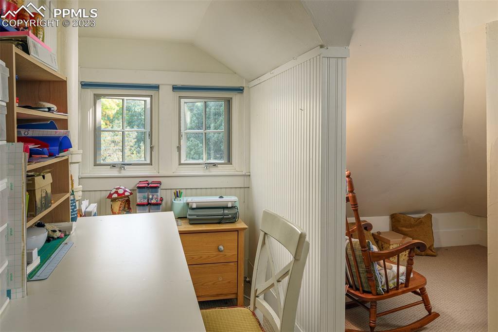 7 5th Street Colorado Springs, CO 80906 - Photo 25 of 46 a view of a workspace with furniture and a window