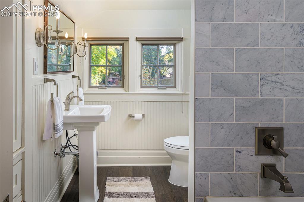 7 5th Street Colorado Springs, CO 80906 - Photo 26 of 46 a bathroom with a sink a toilet and window