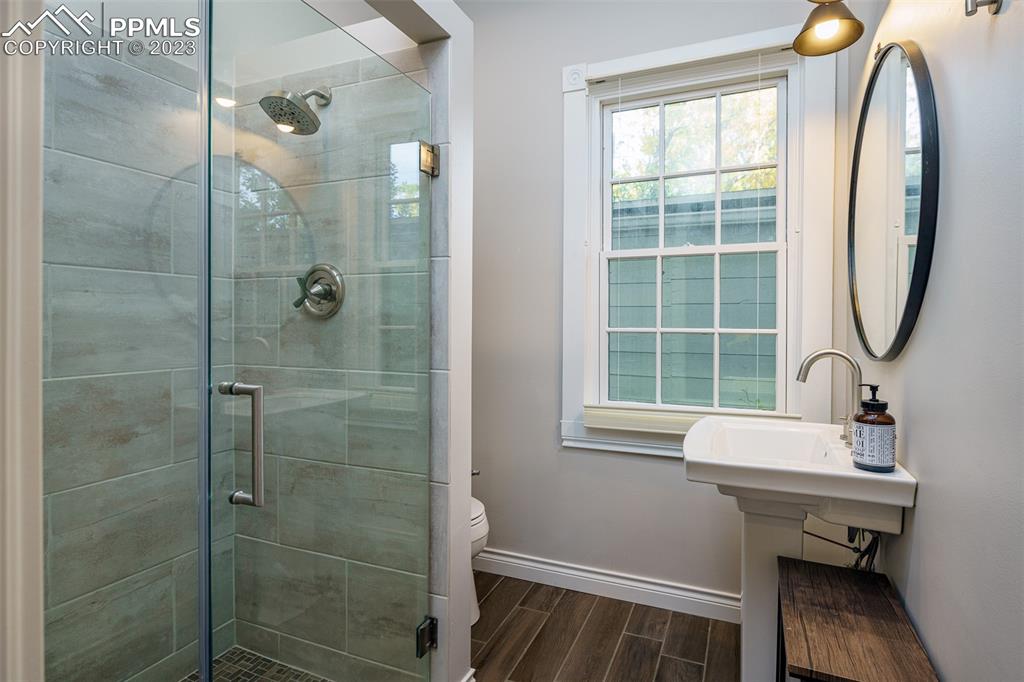 7 5th Street Colorado Springs, CO 80906 - Photo 27 of 46 a bathroom with a sink and a mirror