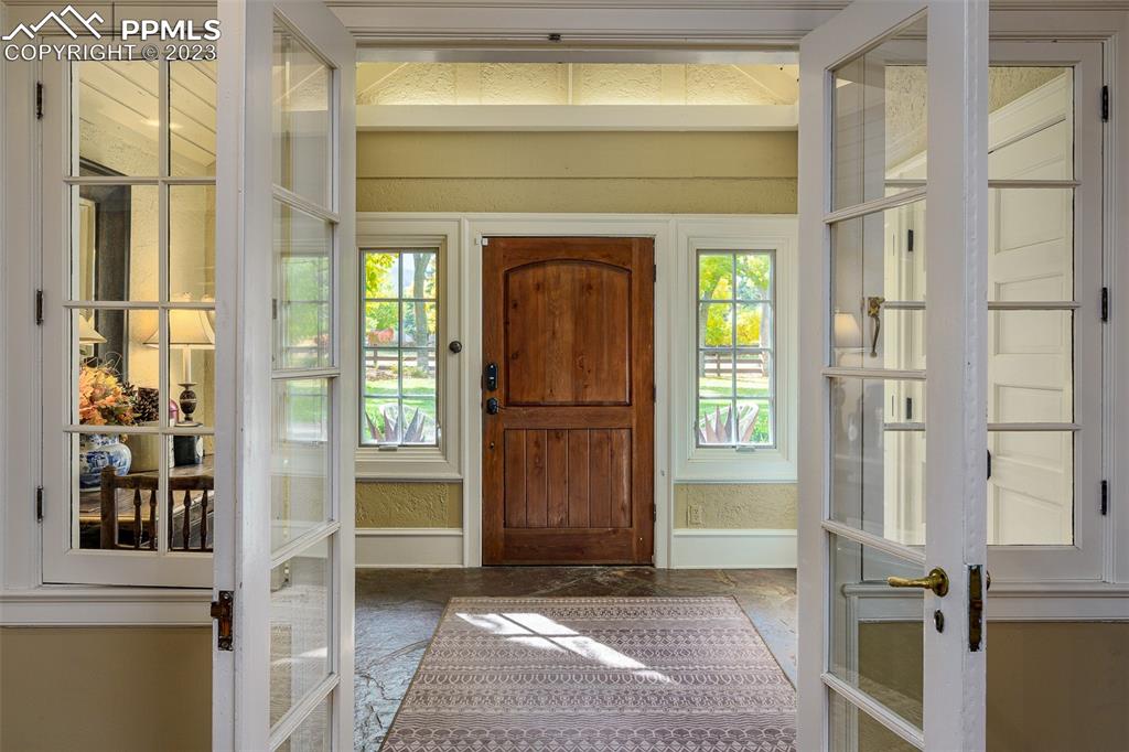 7 5th Street Colorado Springs, CO 80906 - Photo 3 of 46 a view of front door with a door and a couch