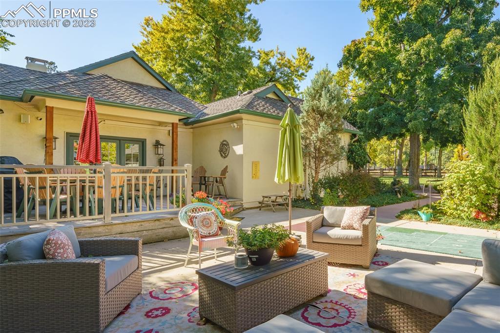 7 5th Street Colorado Springs, CO 80906 - Photo 33 of 46 a outdoor living space with patio furniture and a potted plant