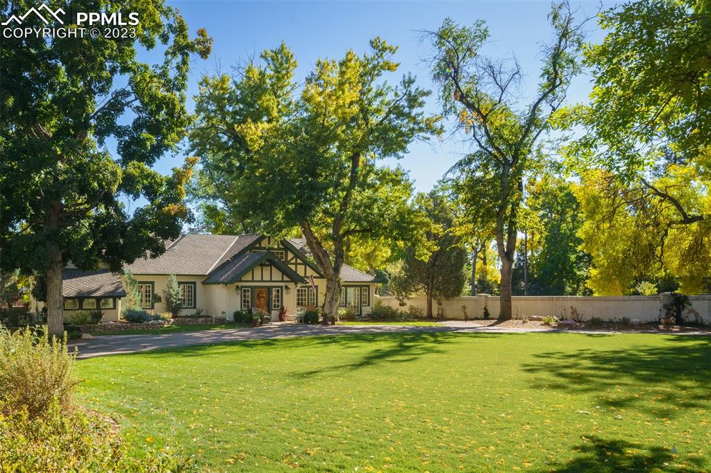 7 5th Street Colorado Springs, CO 80906 - Photo 41 of 46 a front view of a house with swimming pool and sitting area
