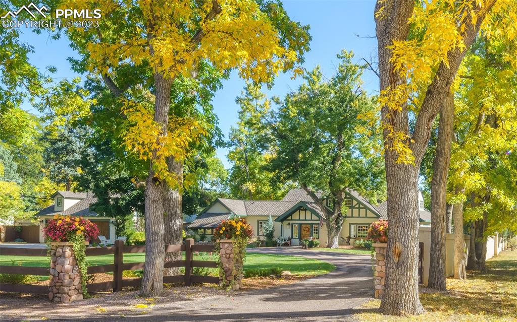 7 5th Street Colorado Springs, CO 80906 - Photo 42 of 46 a front view of a house with a tree and yard