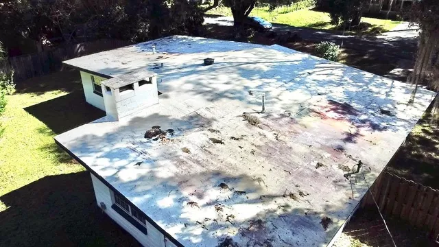 a wooden floor with a large swimming pool in back