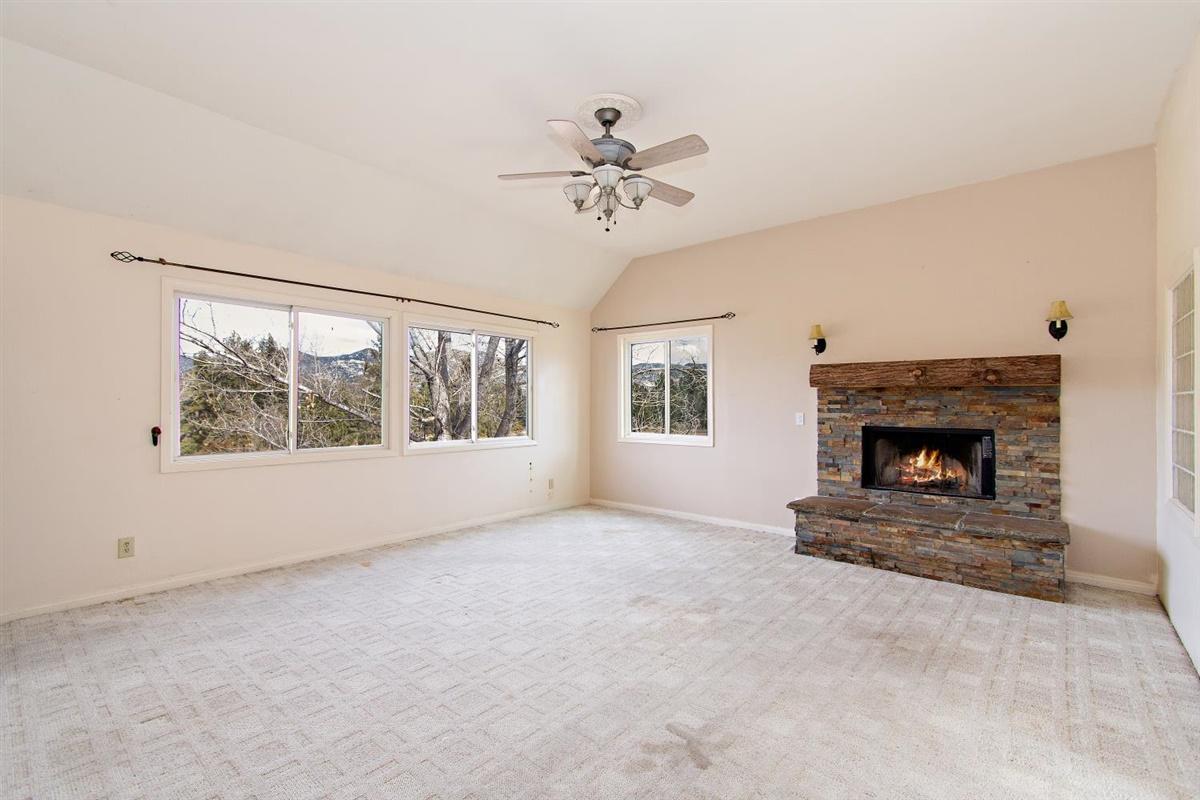 59911 Hop Patch Spring Road Mountain Center, CA 92561 - Photo 15 of 42 a view of an empty room with a fireplace