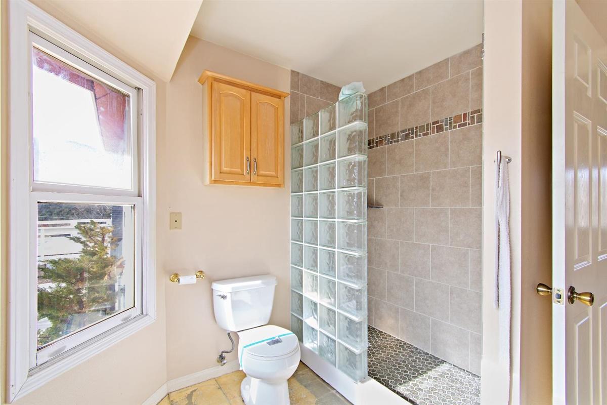 59911 Hop Patch Spring Road Mountain Center, CA 92561 - Photo 17 of 42 a bathroom with a toilet and a shower