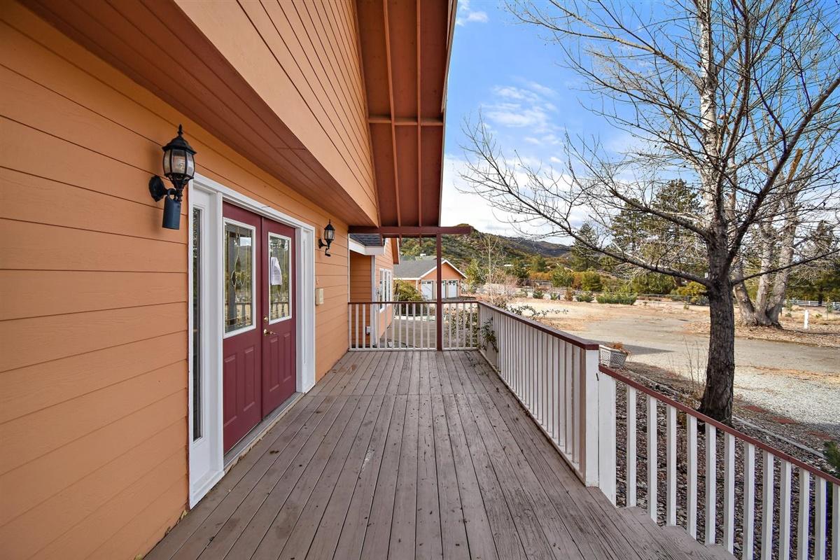 59911 Hop Patch Spring Road Mountain Center, CA 92561 - Photo 25 of 42 a view of balcony with wooden floor and fence