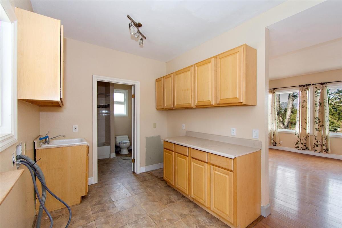 59911 Hop Patch Spring Road Mountain Center, CA 92561 - Photo 5 of 42 a kitchen with sink cabinets and window