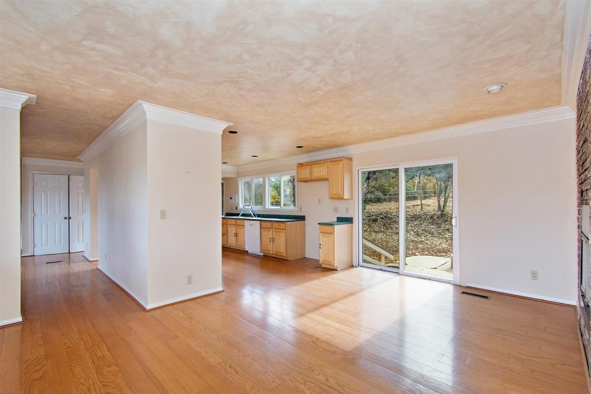 59911 Hop Patch Spring Road Mountain Center, CA 92561 - Photo 7 of 42 a view of an empty room with a window and wooden floor