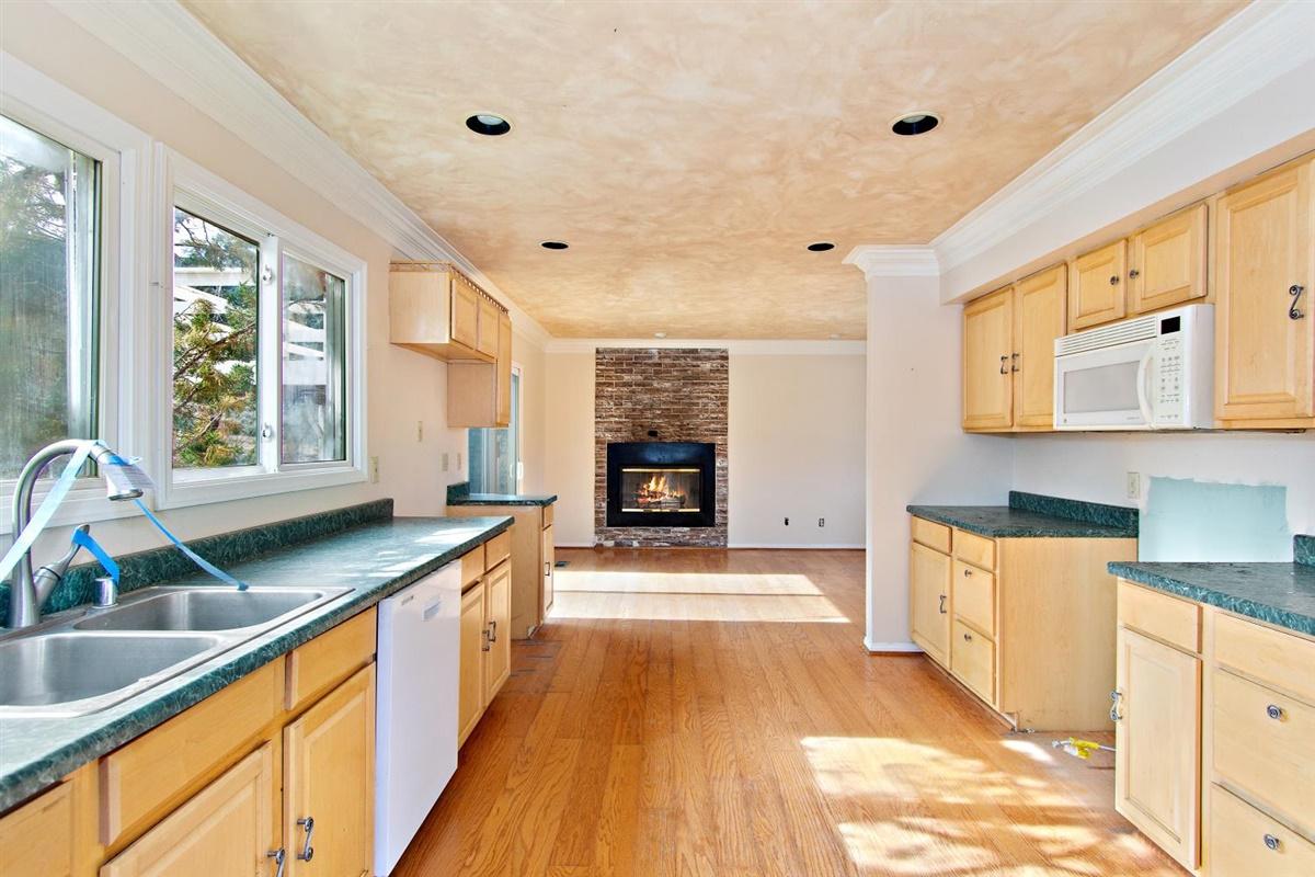 59911 Hop Patch Spring Road Mountain Center, CA 92561 - Photo 9 of 42 a large kitchen with granite countertop a large window and a sink