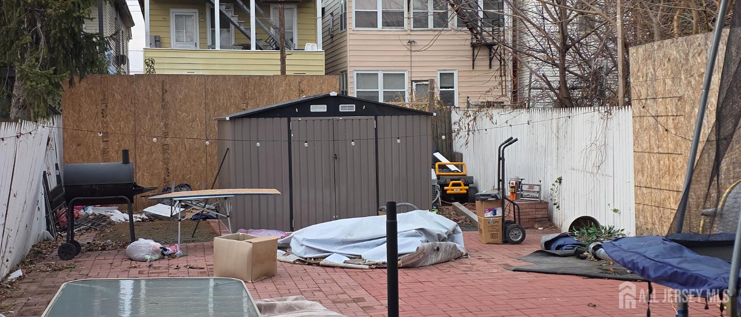 136 Smith Street Elizabeth, NJ 07201 - Photo 18 of 36 a view of a house with backyard and sitting area