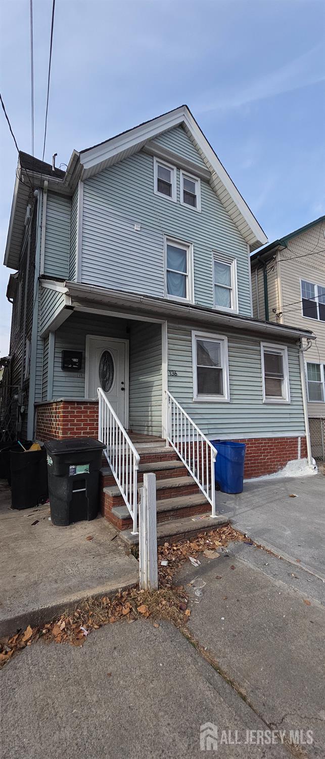 136 Smith Street Elizabeth, NJ 07201 - Photo 2 of 36 a front view of a house with a yard