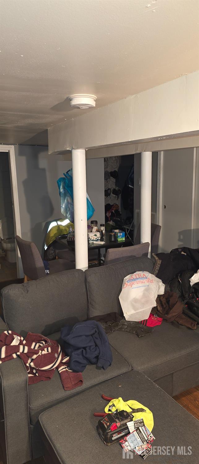 136 Smith Street Elizabeth, NJ 07201 - Photo 24 of 36 a living room with furniture and a fireplace