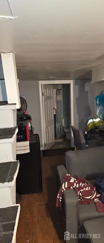 a bedroom with furniture and natural light