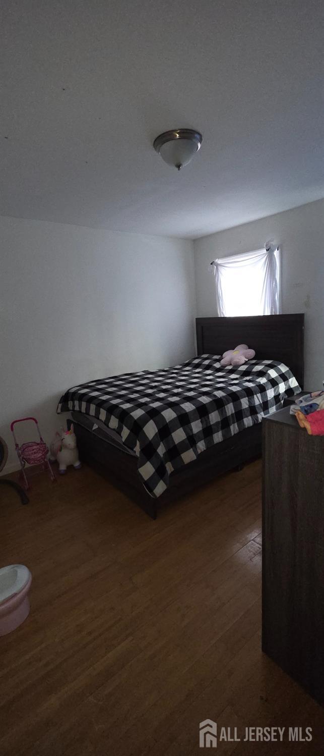 136 Smith Street Elizabeth, NJ 07201 - Photo 32 of 36 a close up of a bed