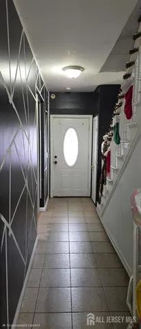 a view of a hallway with washer and dryer