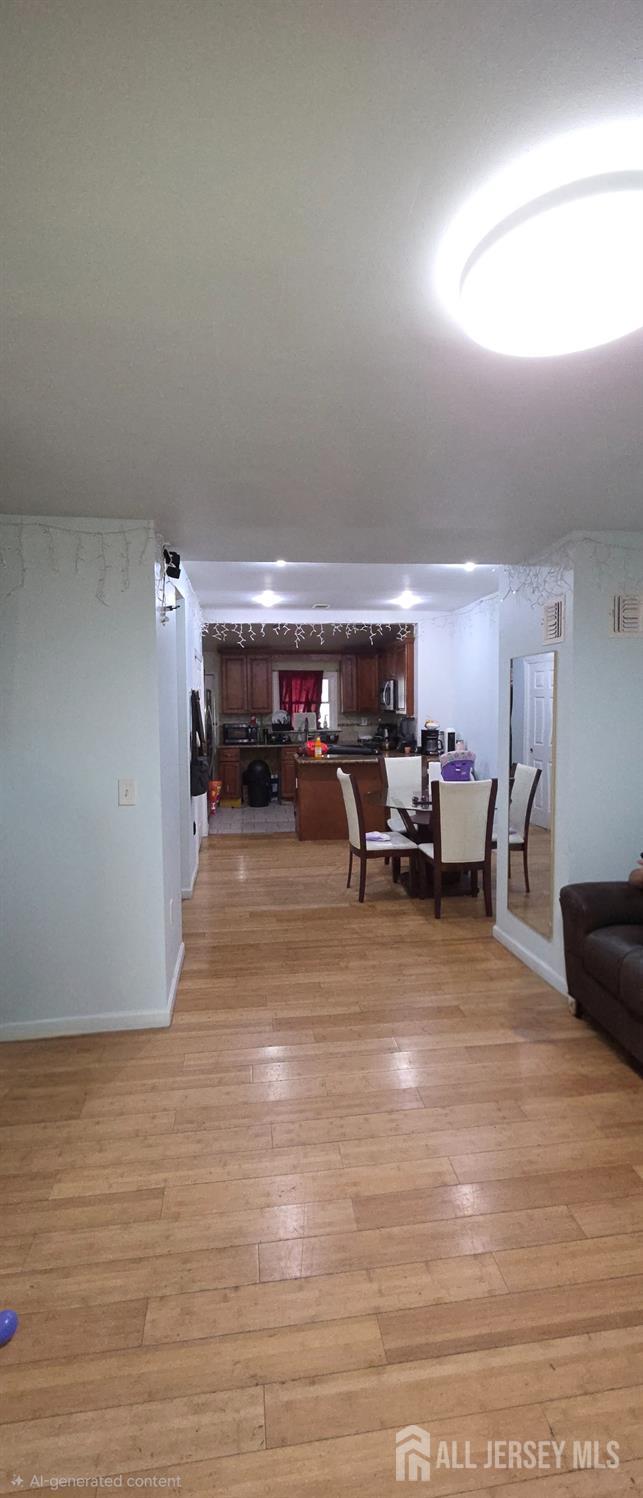 136 Smith Street Elizabeth, NJ 07201 - Photo 9 of 36 a living room with furniture and a wooden floor
