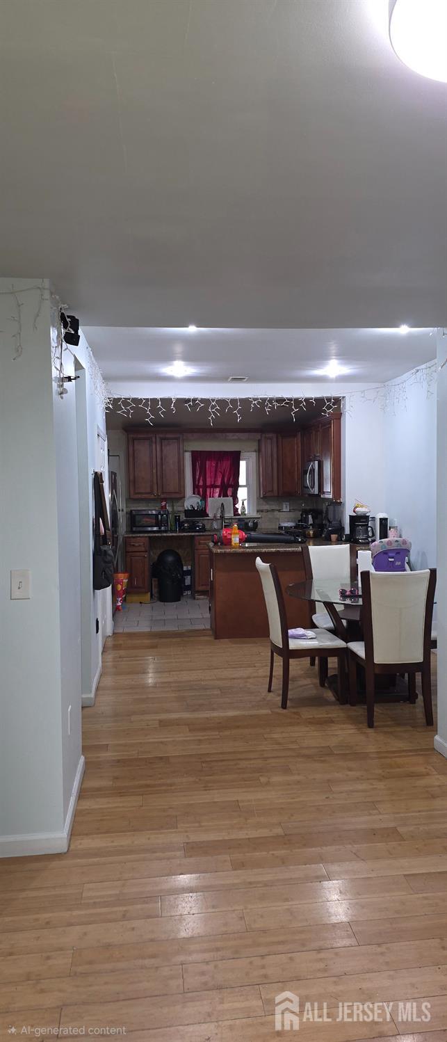 136 Smith Street Elizabeth, NJ 07201 - Photo 10 of 36 a living room with furniture and a table