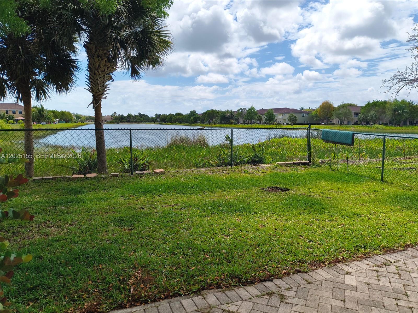 1645 Southeast 20th Road, Unit 1645 Homestead, FL 33035 - Photo 20 of 20 a view of a garden with a tree