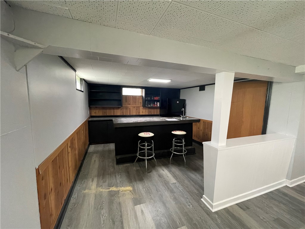 1361 Sussex Road Troy, OH 45373 - Photo 23 of 25 This versatile basement space features a stylish bar area, perfect for entertaining.