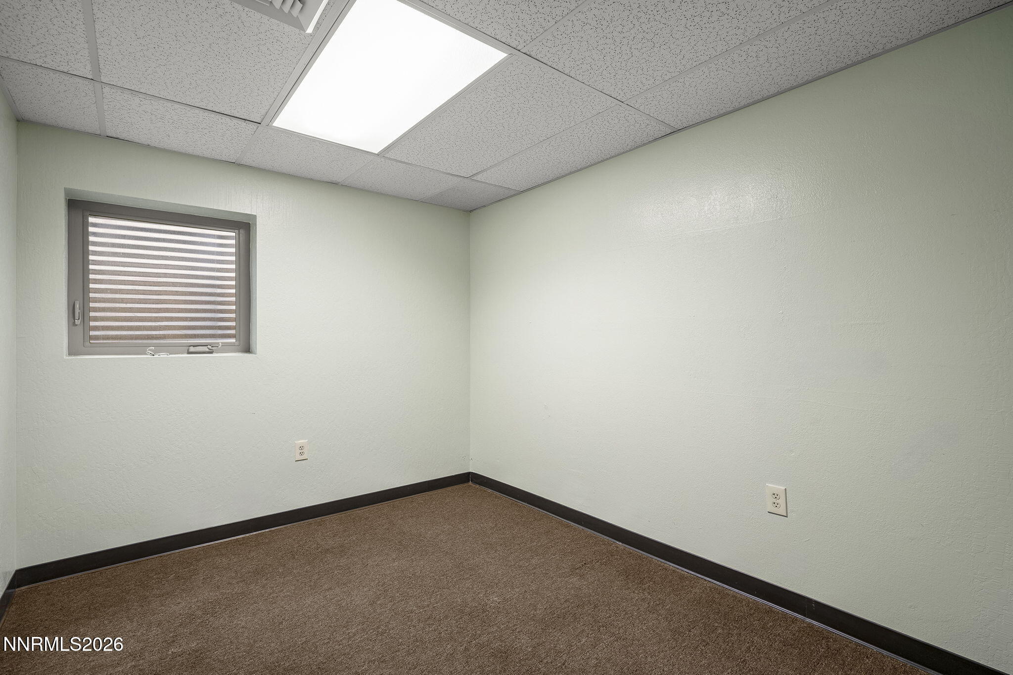 2985 Socrates Drive Reno, NV 89512 - Photo 32 of 52 an empty room with a window