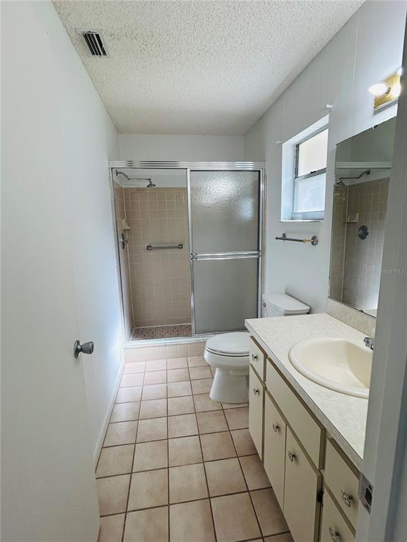 8530 Southwest 90th Street, Unit B Ocala, FL 34481 - Photo 21 of 45 a bathroom with a sink a toilet and shower