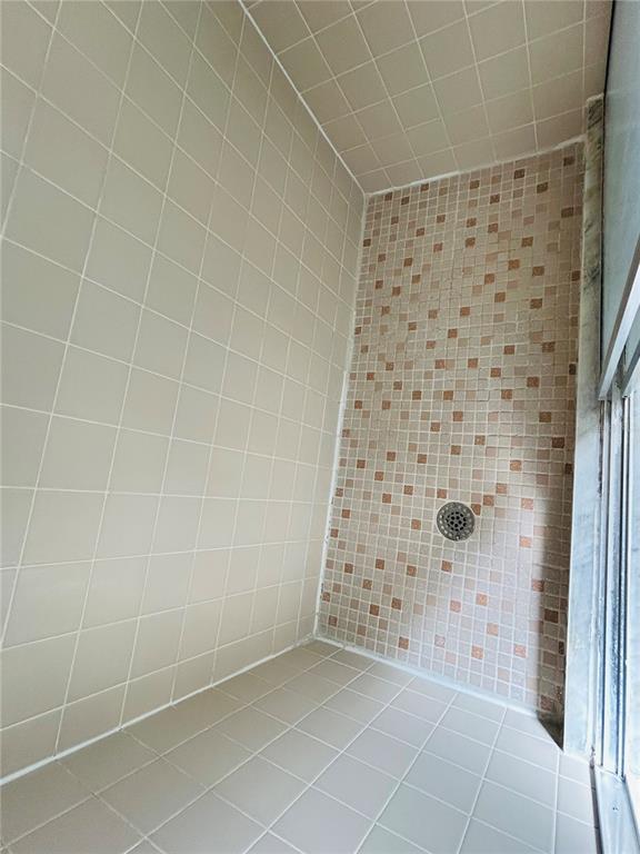 8530 Southwest 90th Street, Unit B Ocala, FL 34481 - Photo 22 of 45 a bathroom with a shower