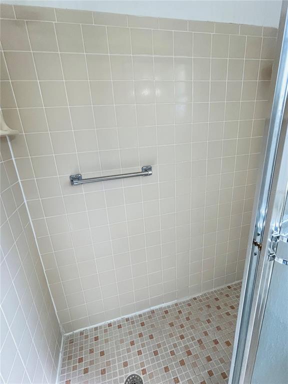 8530 Southwest 90th Street, Unit B Ocala, FL 34481 - Photo 23 of 45 a bathroom with a shower