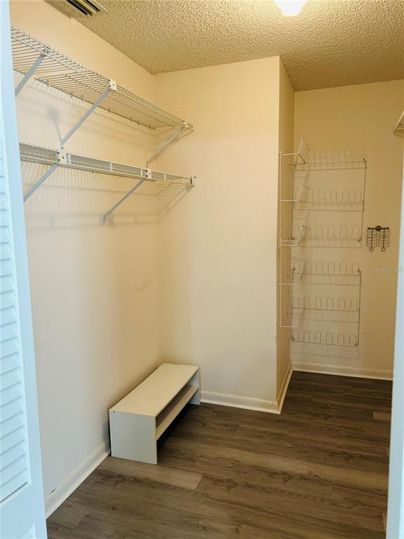 8530 Southwest 90th Street, Unit B Ocala, FL 34481 - Photo 24 of 45 a view of a room with wooden floor and brick walls