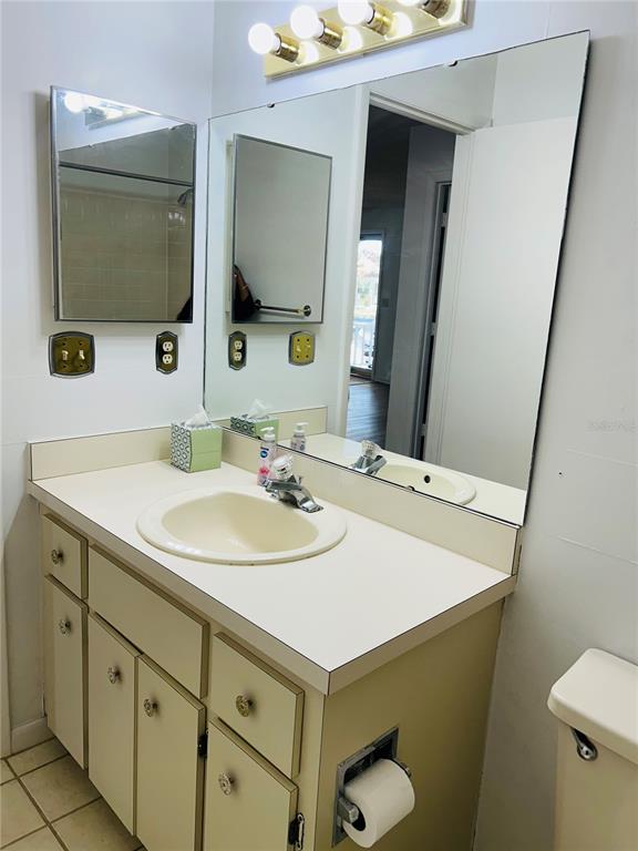 8530 Southwest 90th Street, Unit B Ocala, FL 34481 - Photo 31 of 45 a bathroom with a sink and a mirror
