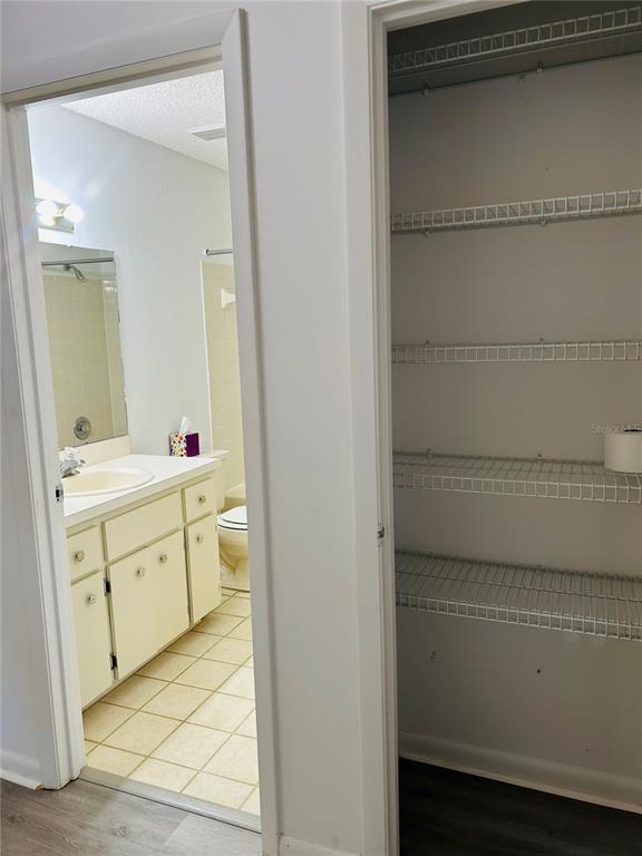 8530 Southwest 90th Street, Unit B Ocala, FL 34481 - Photo 33 of 45 a spacious bathroom with a sink and a mirror