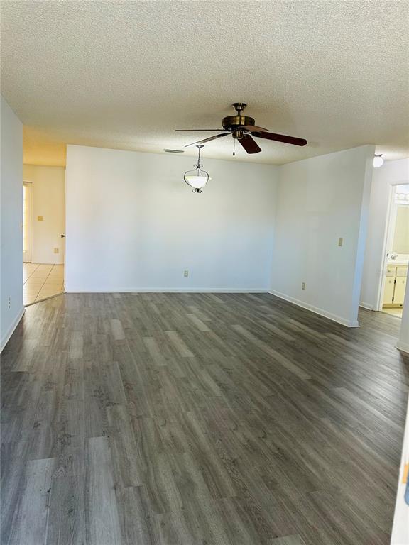 8530 Southwest 90th Street, Unit B Ocala, FL 34481 - Photo 35 of 45 wooden floor in a empty room