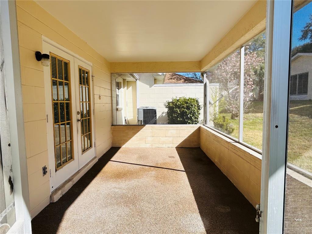 8530 Southwest 90th Street, Unit B Ocala, FL 34481 - Photo 44 of 45 a view of a large window with an outdoor view