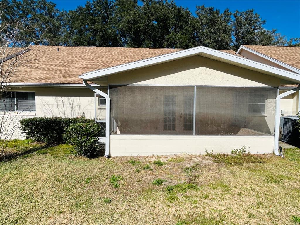 8530 Southwest 90th Street, Unit B Ocala, FL 34481 - Photo 45 of 45 a house with trees in the background