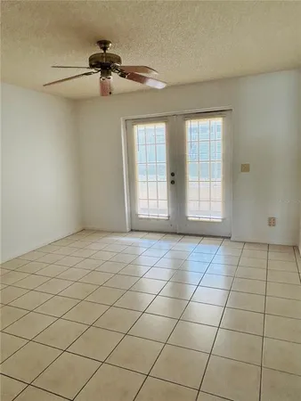 a view of an empty room and a window