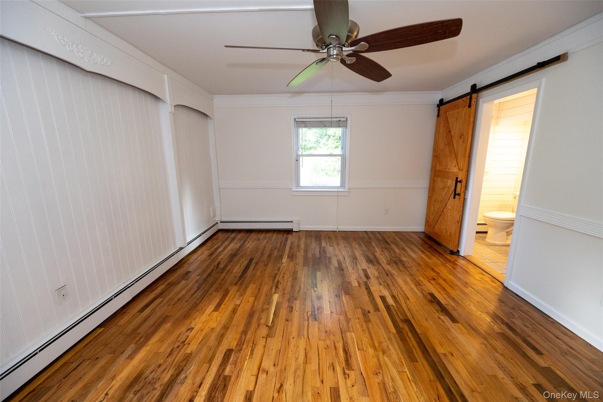 136 Foggintown Road Brewster, NY 10509 - Photo 24 of 50 a view of empty room with wooden floor and fan